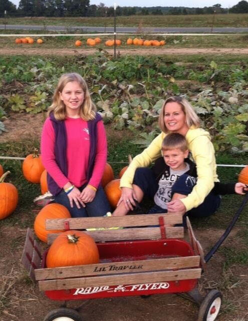 Shannon at a pumpkin patch with her daughter and son
